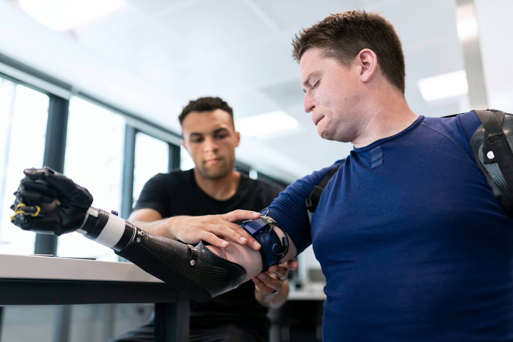 Patient being fitted with prosthetic arm