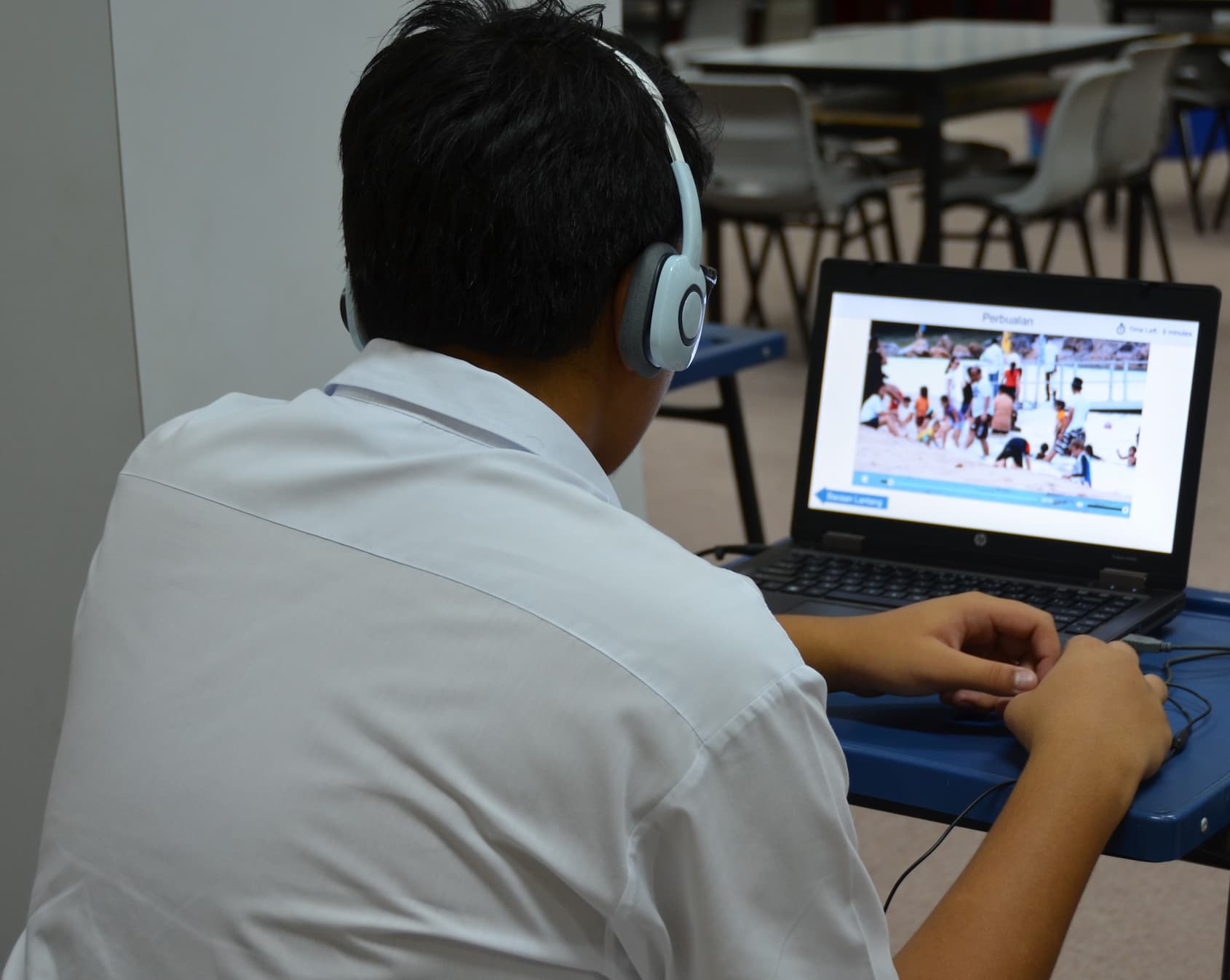 A student watches a video stimulus during a past oral examination