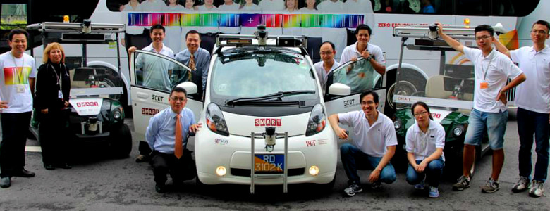 Autonomous Vehicles in Singapore. A team of engineers posing with AVs.